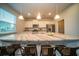 Open kitchen featuring a granite countertop island, stainless steel appliances, and bright lighting at 107 Goose Rd, Summerville, SC 29483