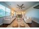 Bright living room featuring hardwood floors, neutral furniture, and an open layout to the kitchen at 107 Goose Rd, Summerville, SC 29483