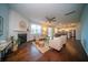 Open-concept living room with fireplace, dining area and kitchen views at 107 Goose Rd, Summerville, SC 29483