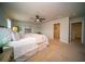 Bright main bedroom featuring neutral decor, a ceiling fan, and a walk-in closet at 107 Goose Rd, Summerville, SC 29483