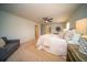 Comfortable main bedroom with a ceiling fan, neutral decor, and an ensuite bathroom at 107 Goose Rd, Summerville, SC 29483