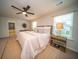 Spacious main bedroom with a ceiling fan, ensuite bathroom, and natural light at 107 Goose Rd, Summerville, SC 29483