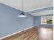 A dining room with wood floors, blue walls and white trim at 1127 Tidal View Ln, Charleston, SC 29412