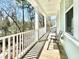 Relaxing balcony with outdoor chair and wooded view at 114 E Respite Ln, Summerville, SC 29483