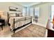 A view of the bedroom that includes a bed, rug, and furniture at 114 E Respite Ln, Summerville, SC 29483