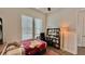 Bright bedroom with natural light, featuring a stylish bookcase, and comfortable furnishings at 114 E Respite Ln, Summerville, SC 29483