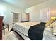 Bright bedroom features a bed, chair, and side table at 114 E Respite Ln, Summerville, SC 29483