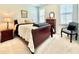 Bright bedroom features a bed, chair, and side table at 114 E Respite Ln, Summerville, SC 29483