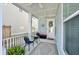 Inviting front porch with seating, a ceiling fan, and outdoor decor at 114 E Respite Ln, Summerville, SC 29483