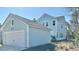 Exterior view of the home with a detached garage and light blue siding at 114 E Respite Ln, Summerville, SC 29483