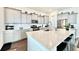 Bright kitchen with gray cabinets, stainless steel appliances, quartz countertops and an island at 114 E Respite Ln, Summerville, SC 29483