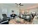 Inviting living room featuring a sleek glass table, piano, and modern furnishings at 114 E Respite Ln, Summerville, SC 29483