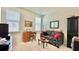 Cozy sitting room features a desk, sofa, and natural light at 114 E Respite Ln, Summerville, SC 29483