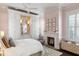 Inviting bedroom with a fireplace and built-in closet at 115 Rutledge Ave # A, Charleston, SC 29401
