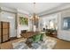 Spacious dining room with a fireplace and view of the living room at 115 Rutledge Ave # A, Charleston, SC 29401