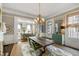 Lovely dining room with fireplace, and view of the living room at 115 Rutledge Ave # A, Charleston, SC 29401