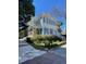 Charming two-story home featuring a spacious porch and beautiful blue shutters at 115 Rutledge Ave # A, Charleston, SC 29401