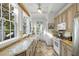 Bright kitchen with lots of natural light and tile backsplash at 115 Rutledge Ave # A, Charleston, SC 29401