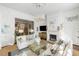 Comfortable living room featuring a fireplace, mantle, and TV at 115 Rutledge Ave # A, Charleston, SC 29401