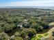 Expansive aerial view showcasing lush greenery, golf course, waterfront homes and the ocean in the distance at 12 Dune Crest Trace Trl, Seabrook Island, SC 29455