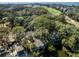 Captivating aerial view showcasing home nestled amongst lush greenery and golf course at 12 Dune Crest Trace Trl, Seabrook Island, SC 29455
