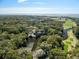 Beautiful aerial shot with waterfront property, trees, golf course, and ocean views at 12 Dune Crest Trace Trl, Seabrook Island, SC 29455