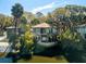 Waterfront homes sit atop a lake surrounded by lush greenery at 12 Dune Crest Trace Trl, Seabrook Island, SC 29455