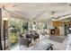 Open floor plan living area with lots of windows, kitchen, and views of the trees at 12 Dune Crest Trace Trl, Seabrook Island, SC 29455