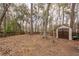 The backyard has wooden fencing with a storage shed, offering great utility and extra storage space at 122 Moon Shadow Ln, Summerville, SC 29485