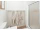 The bathroom featuring wainscoting and a glass shower enclosure, creating a stylish space at 122 Moon Shadow Ln, Summerville, SC 29485