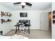 Bedroom featuring a desk with dual monitors, wall-mounted TV, carpet, and ceiling fan at 122 Moon Shadow Ln, Summerville, SC 29485