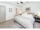 A bright bedroom with carpeted floors and a stylish patterned rug under a large queen-sized bed at 122 Moon Shadow Ln, Summerville, SC 29485