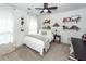 Cozy bedroom with ample natural light, ceiling fan, and decorative shelves at 122 Moon Shadow Ln, Summerville, SC 29485