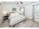 Comfortable bedroom featuring a bed, rug, side tables with lamps, and window for natural light at 122 Moon Shadow Ln, Summerville, SC 29485