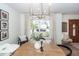 Bright dining area with elegant lighting, view to the outside, and stylish accents at 122 Moon Shadow Ln, Summerville, SC 29485