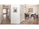 Bright dining area with modern chandelier and stylish decor open to a hallway with wood flooring at 122 Moon Shadow Ln, Summerville, SC 29485