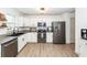 Modern kitchen with white cabinetry, stainless steel appliances, and granite countertops at 122 Moon Shadow Ln, Summerville, SC 29485