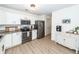 Modern kitchen features stainless steel appliances, granite countertops, and white cabinets with ample storage at 122 Moon Shadow Ln, Summerville, SC 29485