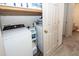 Convenient laundry room with shelving for storage, modern washer and dryer, and laminate flooring at 122 Moon Shadow Ln, Summerville, SC 29485