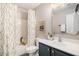 Well-lit bathroom features a shower-tub combo, patterned curtain, and modern vanity at 1271 Island Club Dr # B, Charleston, SC 29492