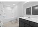Bathroom features shower-tub combo and dark-stained vanity with chrome faucet at 128 Surfbird Rd, Summerville, SC 29486