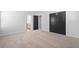 Bedroom featuring a pair of black bifold doors and soft carpet at 128 Surfbird Rd, Summerville, SC 29486