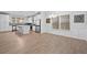 Bright dining area with wood flooring, wainscoting, and open plan to the kitchen at 128 Surfbird Rd, Summerville, SC 29486