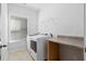 Well-lit laundry room features modern washer and dryer, and functional countertop space at 128 Surfbird Rd, Summerville, SC 29486