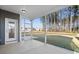 The screened porch provides a transition to the outdoors, with a door to the backyard at 128 Surfbird Rd, Summerville, SC 29486
