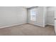 This bedroom offers a bright window, neutral carpet and paint, and ample space at 131 Horizon Ridge Dr, Summerville, SC 29486