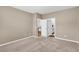 This bedroom features neutral paint and carpet, with two doors leading to a bathroom and office space at 131 Horizon Ridge Dr, Summerville, SC 29486