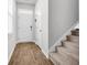 Clean entryway featuring hard wood floors with carpeted stairs leading up to the next level at 131 Horizon Ridge Dr, Summerville, SC 29486