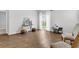 Bright living room with wood floors, sliding glass doors to the backyard, and neutral décor at 131 Horizon Ridge Dr, Summerville, SC 29486