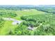 Beautiful aerial view showcasing a pond, mature trees, and the charming home at 13959 Cottageville Hwy, Cottageville, SC 29435